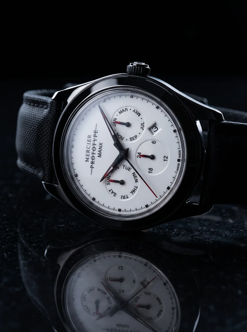 Manx Meridian Blanc rim-lit on black stone