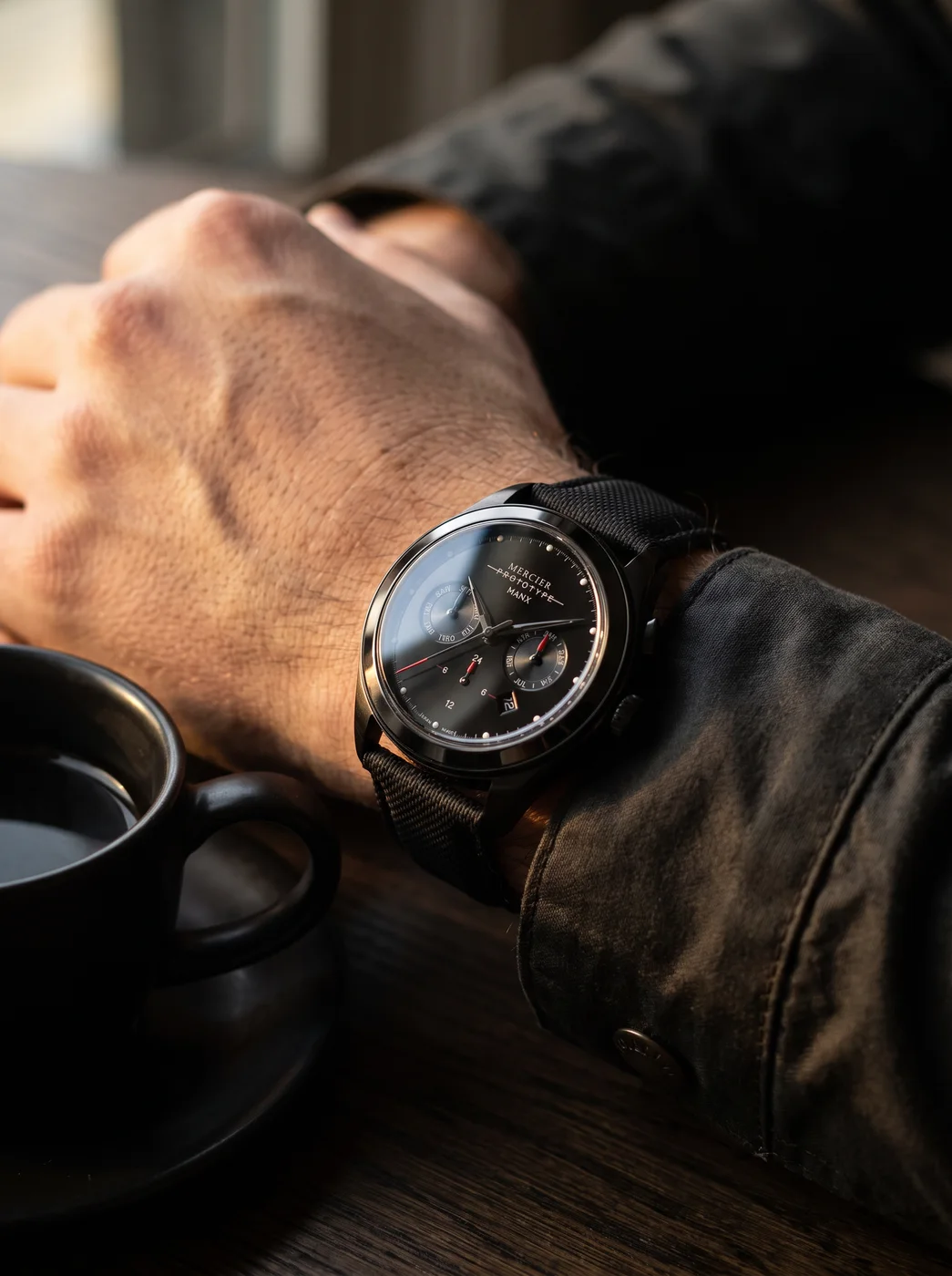 Manx Meridian Noir worn on the wrist, sailcloth strap